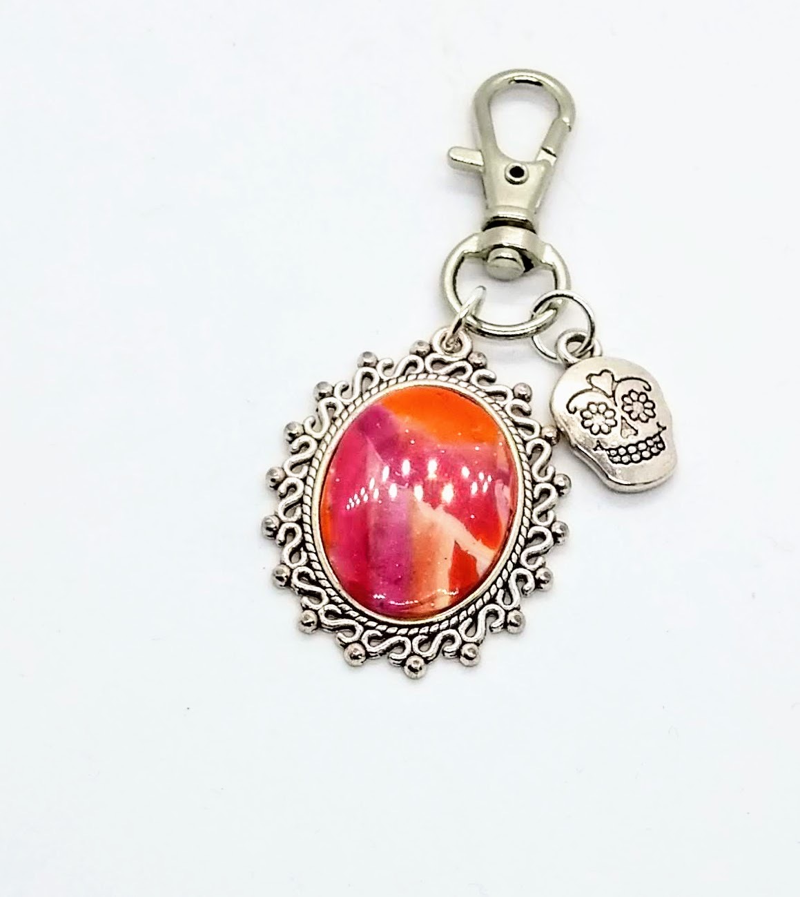 Polymer clay bag clip in pinks, orange and white with a sugar skull charm Polymer clay bag clip in pinks, orange and white with a sugar skull charm