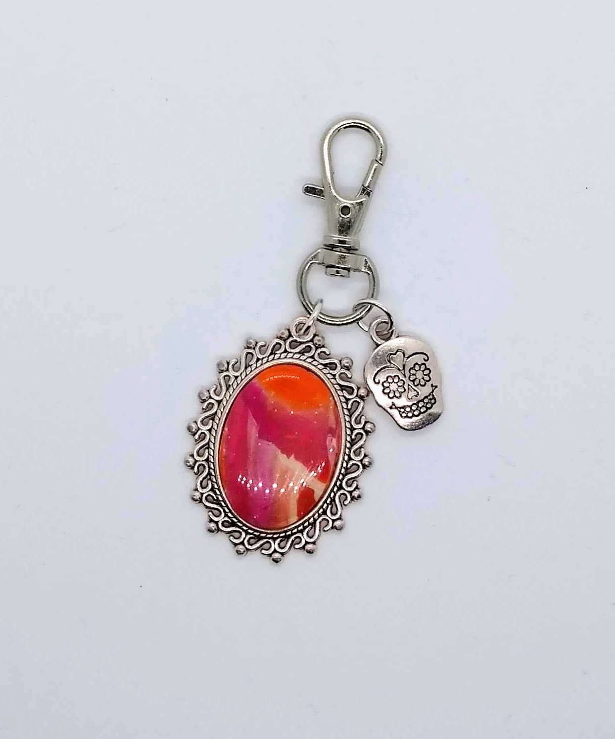 Polymer clay bag clip in pinks, orange and white with a sugar skull charm Polymer clay bag clip in pinks, orange and white with a sugar skull charm